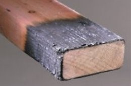 Charred fire resistant treated lumber