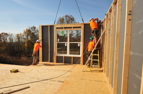 Wall Panels being installed in the 2015 Framing the American Dream home.